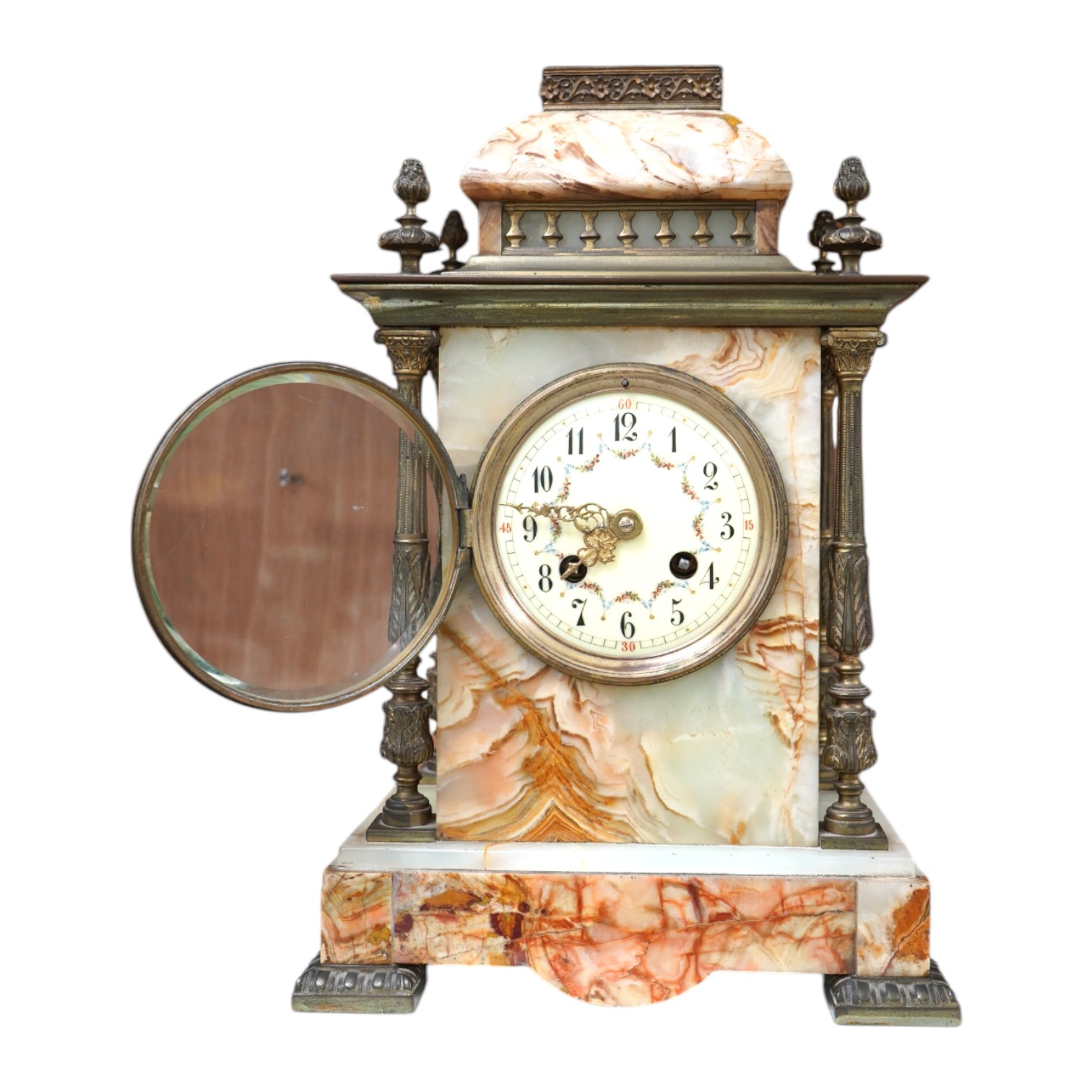 An early 20th century marble and onyx mantel clock with enamel dial with pendulum, no key, 32cm high. Condition - fair, untested